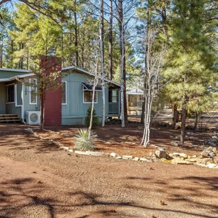 Buy this 2 bed house on 1240 North 43rd Drive in Show Low, AZ 85901