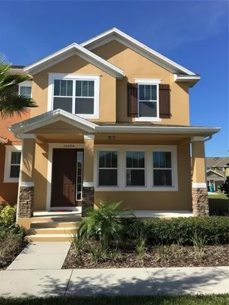 Rent this 4 bed townhouse on Auburn Sky Lane in Orlando, FL 32827