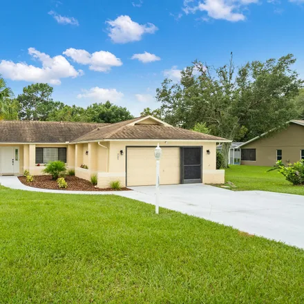 Buy this 4 bed house on 11201 Rainbow Woods Loop in Spring Hill, FL 34609
