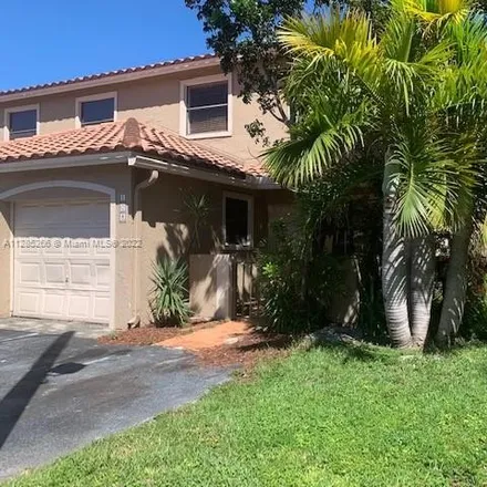 Rent this 3 bed townhouse on 401 West 49th Street in Palm Springs, Hialeah