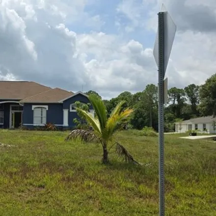 Buy this 5 bed house on 313 Warner Road Southwest in Palm Bay, FL 32908