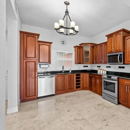 Rent this 2 bed condo on unnamed road in West Palm Beach, FL 33049