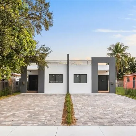 Buy this 9 bed house on 400 Northwest 69th Street in Edison Center, Miami
