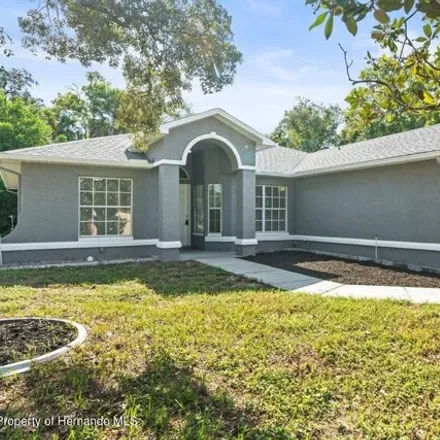 Rent this 3 bed house on 110 Outlook Ave in Spring Hill, Florida