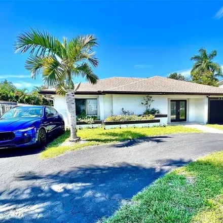 Buy this 4 bed house on 3355 Northeast 20th Avenue in Coral Woods, Oakland Park
