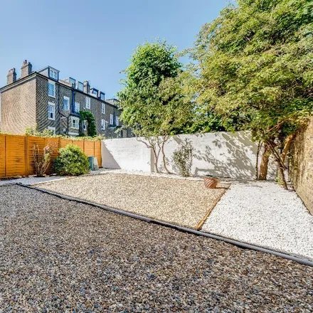 Rent this 4 bed townhouse on Clapham Manor Primary School in Belmont Road, London