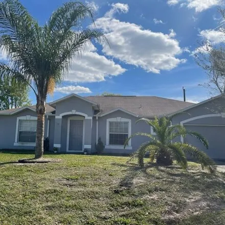 Buy this 3 bed house on 1238 Southwest Calmar Avenue in Port Saint Lucie, FL 34953