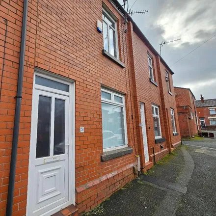 Rent this 2 bed townhouse on West Street in Farnworth, BL4 7RR