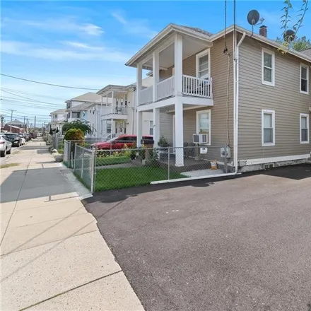 Buy this 6 bed townhouse on 184 Cottage Street in Central Falls, RI 02863