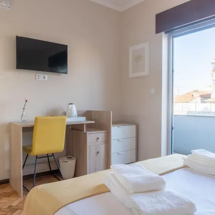 Rent this 8 bed apartment on Rua de Faria Guimarães in 4200-291 Porto, Portugal