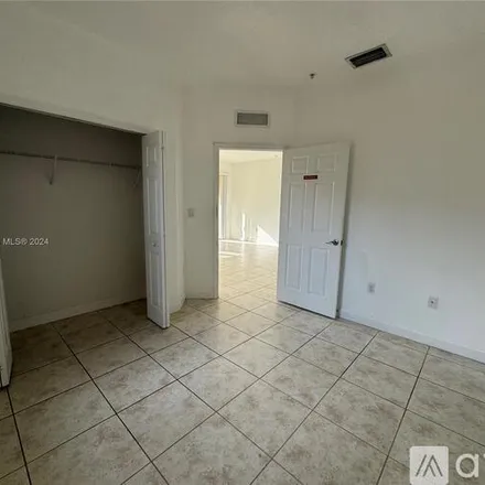 Rent this 3 bed apartment on 10022 NW 7th St
