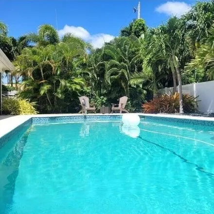 Rent this 3 bed house on 1124 Emerald Lane in Palm Beach Isles, Riviera Beach