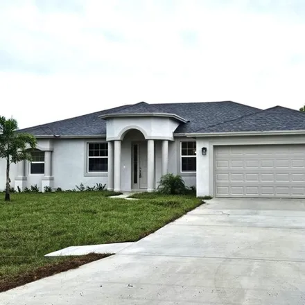 Buy this 4 bed house on 585 SW Jeanne Ave in Port Saint Lucie, Florida