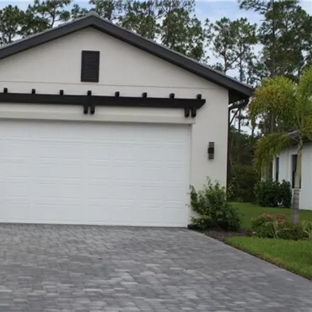 Rent this 3 bed townhouse on 14620 Kingfisher Loop in Naples, Florida