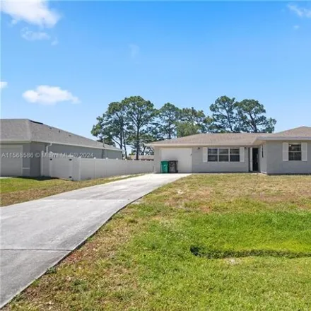 Buy this 3 bed house on 180 Northwest Curry Street in Port Saint Lucie, FL 34983