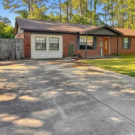 Buy this 4 bed house on 1387 Continental Drive in Escambia County, FL 32506