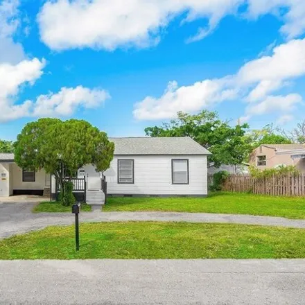 Buy this 3 bed house on 937 43rd Street in West Palm Beach, FL 33407