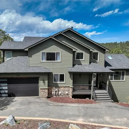 Buy this 4 bed house on 26319 Sweetbriar Trail in Kittredge, Evergreen