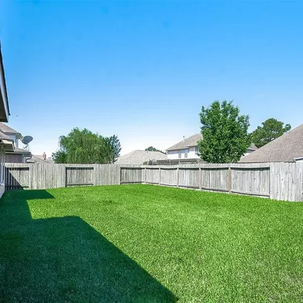 Rent this 3 bed apartment on 24670 Cobble Canyon Lane in Fort Bend County, TX 77494