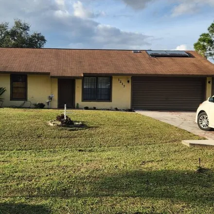 Buy this 3 bed house on 1227 Tiffany Avenue Southeast in Palm Bay, FL 32909