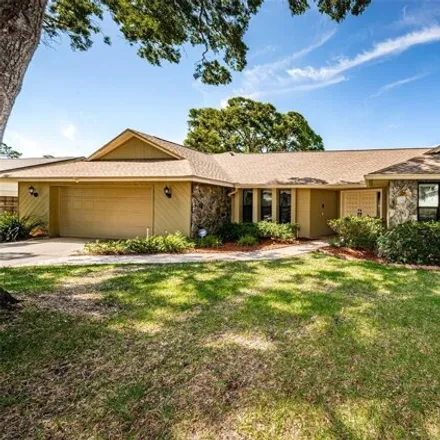 Buy this 4 bed house on 1680 Honeybear Ln in Dunedin, Florida