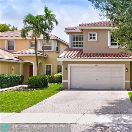 Buy this 4 bed house on 4014 Crescent Creek Drive in Coconut Creek, FL 33073