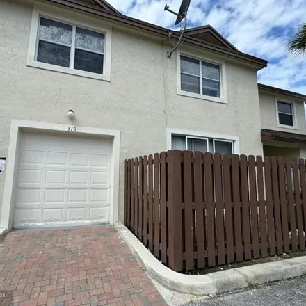 Rent this 3 bed townhouse on 300 Southwest 95th Terrace in Pembroke Pines, FL 33025