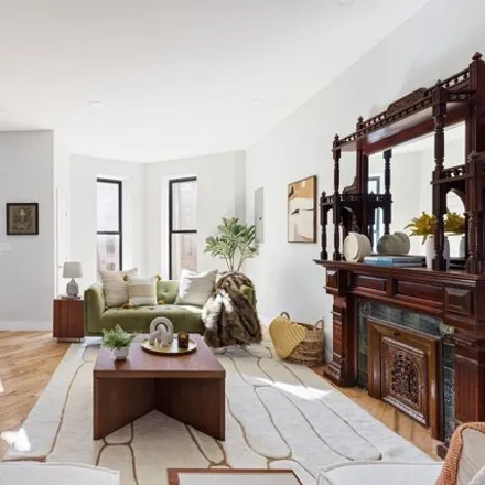 Buy this 7 bed townhouse on 497 Madison Street in New York, NY 11221
