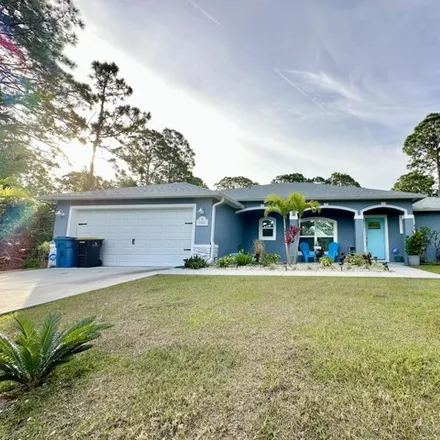 Rent this 3 bed house on 972 Pandora Road Southeast in Palm Bay, FL 32909