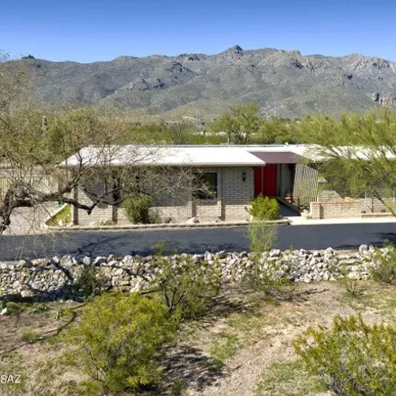 Buy this 4 bed house on 11041 East Roger Road in Pima County, AZ 85749