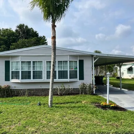 Buy this studio apartment on 5967 River Grove Drive in Micco, Brevard County