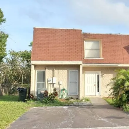 Rent this 3 bed townhouse on 284 Sunshine Drive in Coconut Creek, FL 33066