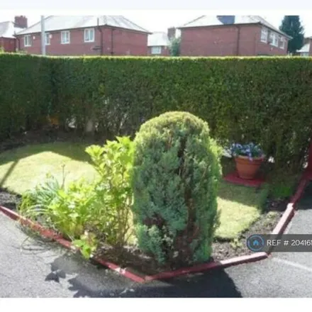 Rent this 3 bed townhouse on Chesham Avenue in Wythenshawe, M22 9PX