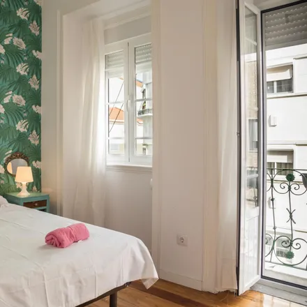 Rent this 2 bed room on Chafariz do Alto do Pina in Rua Sabino de Sousa, 1170-284 Lisbon