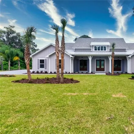 Buy this 4 bed house on 4398 Shirley Shores Road in Tavares, FL 32778