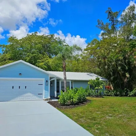 Buy this 3 bed house on 419 Southwest Namboit Place in Port Saint Lucie, FL 34953