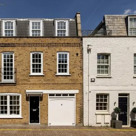 Buy this 3 bed townhouse on 3 Coleherne Mews in London, SW10 9AN