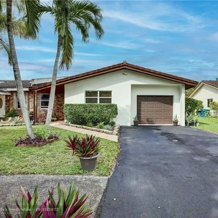 Buy this 4 bed house on 2426 Northwest 91st Avenue in Coral Springs, FL 33065