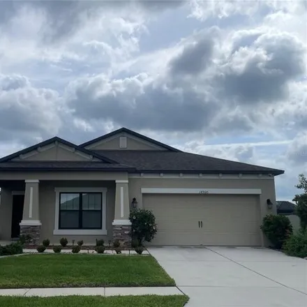 Rent this 4 bed house on 18944 Henequen Lane in Pasco County, FL 34610