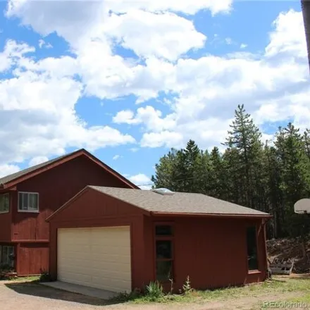 Buy this 4 bed house on 31714 Black Widow Drive in Jefferson County, CO 80433