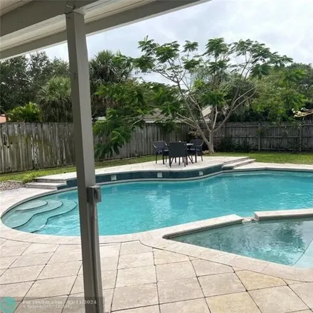 Buy this 4 bed house on 3037 Northwest 27th Avenue in Boca Raton, FL 33434