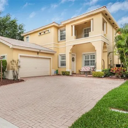 Buy this 4 bed house on 5704 Northwest 121st Avenue in Heron Bay South, Coral Springs