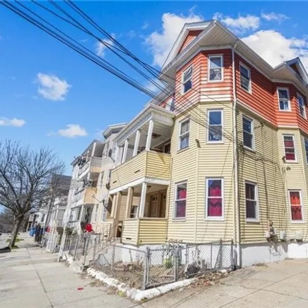 Buy this 9 bed townhouse on 153 Wendell Street in Olneyville, Providence