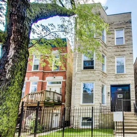 Rent this 4 bed condo on 1448 N Washtenaw Ave Unit 1 in Chicago, Illinois