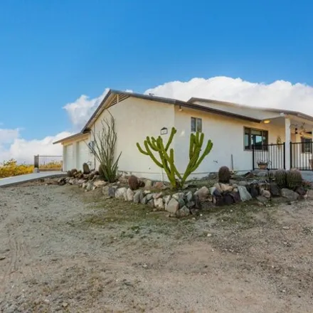 Buy this 3 bed house on 1402 North 234th Avenue in Buckeye, AZ 85396