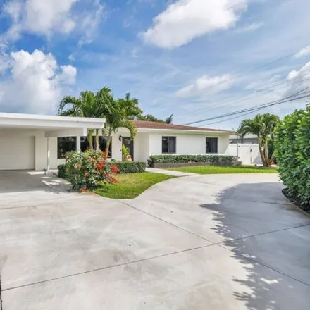 Buy this 3 bed house on 7722 Pine Tree Lane in Lake Clarke Shores, Palm Beach County