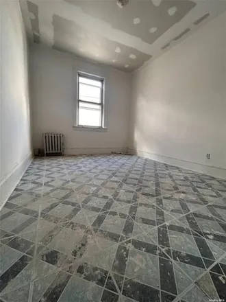 Rent this 3 bed house on 78-25 88th Avenue in New York, NY 11421