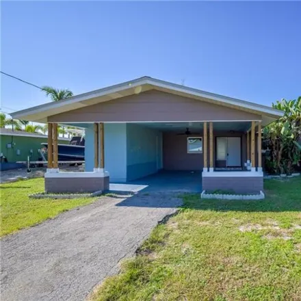 Buy this 3 bed house on 1450 Northeast 4th Terrace in Cape Coral, FL 33909