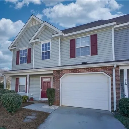 Buy this 3 bed townhouse on 201 Blue Robin Way in Greensboro, NC 27409