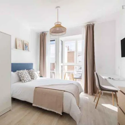 Rent this 12 bed room on Lavandería Magnolia in Calle de las Magnolias, 28029 Madrid
